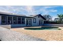 Inviting kidney-shaped pool with brick patio and landscaping at 6747 Whispering Pines Rd, Orlando, FL 32824