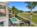 Resort-style pool and spa with patio and golf course views at 1217 Radiant St, Reunion, FL 34747
