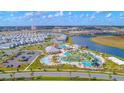 Community with pools, landscaping, and homes at 2811 Bookmark Dr, Kissimmee, FL 34746