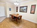Dining area with wood table and chairs at 8010 Tuscany Way # 3103, Davenport, FL 33896