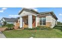 Two-story house with a two-car garage and brick driveway at 2686 Meadowedge Loop, Saint Cloud, FL 34772