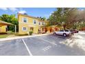 Two-story townhome with playground and parking spaces at 1135 Park Ridge Cir, Kissimmee, FL 34746