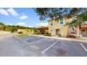 Two-story townhome with playground nearby and parking at 1135 Park Ridge Cir, Kissimmee, FL 34746