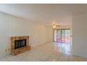 Bright living room with tile floors, fireplace, and sliding glass doors at 824 Park Lake Pl # 824, Maitland, FL 32751