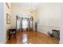 Formal dining room with hardwood floors and large windows at 840 Coach Lamp Ct, Sanford, FL 32771