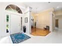 Bright entryway with tile floors and a view into the living area at 840 Coach Lamp Ct, Sanford, FL 32771