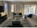 Spacious living room with comfortable seating and large windows at 7441 Marker Ave, Kissimmee, FL 34747