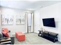 Bright bonus room with TV and comfortable seating at 7441 Marker Ave, Kissimmee, FL 34747