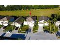 Two-story house viewed from above, showcasing the home's landscaping at 1821 Morning Star Dr, Clermont, FL 34714