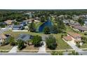 Aerial view of house and neighborhood with pond at 3260 Marshfield Preserve Way, Kissimmee, FL 34746