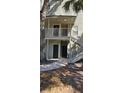 Building exterior with stairs leading to apartment entrances at 6016 Westgate Dr # 301, Orlando, FL 32835