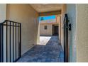 View of gated backyard access through a covered walkway at 567 Villa Park Rd, Kissimmee, FL 34759