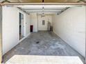 Clean and spacious single-car garage with overhead door and ample storage space at 2732 Oakwater Dr # 101, Kissimmee, FL 34747