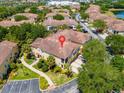 Aerial view of townhome community with lake nearby at 2732 Oakwater Dr # 101, Kissimmee, FL 34747