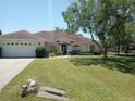 One-story home with attached garage and landscaped yard at 4572 Nw 32Nd St, Ocala, FL 34482