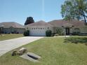 One-story home with attached garage and landscaped yard at 4572 Nw 32Nd St, Ocala, FL 34482