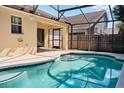 Inviting screened-in pool with surrounding patio at 2726 Randal Way, Kissimmee, FL 34743
