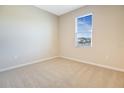 Simple bedroom with neutral walls, carpeted floor, and window with blinds at 2204 Mac Blvd, Eagle Lake, FL 33839