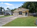 Single story house with attached garage and landscaping at 2912 Willow Oak Ct, Kissimmee, FL 34744