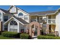Two-story condo building with brick accents and landscaping at 5014 Laguna Bay Cir # 108, Kissimmee, FL 34746