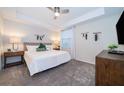 Spacious main bedroom with king-size bed, nightstands, and a large TV at 3131 Paradox Cir # 108, Kissimmee, FL 34746