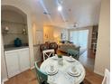 Bright dining area with a round table and chairs at 8826 Dunes Ct # 207, Kissimmee, FL 34747