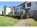 Townhouse with private gated entrance and landscaped walkway at 121 Kenny Blvd, Haines City, FL 33844
