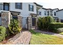 Townhouse with private gated entrance and landscaped walkway at 121 Kenny Blvd, Haines City, FL 33844