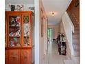 Bright entryway with tiled floor and staircase at 5038 Downing St # 7, Orlando, FL 32839
