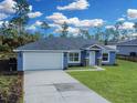 Newly built home with a two-car garage and landscaped yard at 16617 Sw 31St Cir, Ocala, FL 34473