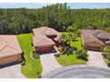 Aerial view of house with palm trees and neighborhood at 806 Ebb Tide Ln, Poinciana, FL 34759