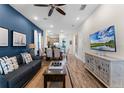 Open living room and dining area with hardwood floors at 3044 Salted Rim Rd, Kissimmee, FL 34747