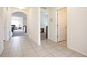 Bright and spacious entryway with tile floors and views into the living room and a hallway at 1843 Brockridge Rd, Kissimmee, FL 34744