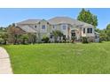 Two-story house with a large front yard at 9502 Hempel Cove Blvd, Windermere, FL 34786