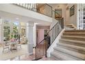 Elegant entryway with a staircase and tile flooring at 9502 Hempel Cove Blvd, Windermere, FL 34786