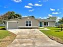 Newly built single-Gathering home with a driveway at 705 Harland Ct, Kissimmee, FL 34758