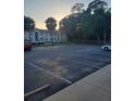 Parking lot with cars parked, providing ample parking space for residents at 414 Banana Cay Dr # I, South Daytona, FL 32119