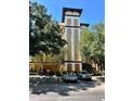 Building exterior with parking and landscaping at 12539 Floridays Resort Dr # 104 D, Orlando, FL 32821