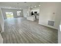 Open concept living room, kitchen, and dining area with tile floors at 274 Elm Ct, Kissimmee, FL 34759