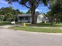 One-story home with a tree-lined street and curb appeal at 101 Albert St, Winter Springs, FL 32708