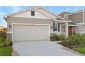 New construction home with two-car garage and landscaped front yard at 6333 Clover St, Lake Hamilton, FL 33851