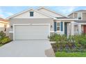 New construction home with two-car garage and landscaped front yard at 6333 Clover St, Lake Hamilton, FL 33851