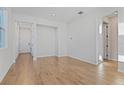 Bright foyer with wood-look tile flooring and access to other rooms at 6333 Clover St, Lake Hamilton, FL 33851