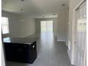 Spacious living room with tile floors and an open floor plan at 2757 Creekmore Ct, Kissimmee, FL 34746