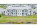 Aerial of apartment building near a lake at 3121 Paradox Circle 207 # 207, Kissimmee, FL 34746
