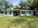 Back of house featuring a patio and large backyard at 1730 Old Apopka Rd, Apopka, FL 32703