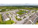 Aerial view of townhome community near a lake at 301 Captiva Dr, Davenport, FL 33896