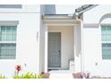 Gray front door with simple landscaping at 301 Captiva Dr, Davenport, FL 33896