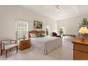 Spacious primary bedroom with ample natural light and sitting area at 114 Ridge View Dr, Davenport, FL 33837
