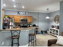 Kitchen with island and breakfast bar at 7132 Five Oaks Dr, Saint Cloud, FL 34773